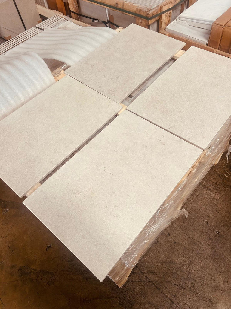 Dolce Crema 18X18 Limestone tiles stacked on wooden pallet