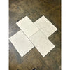 Dolce Crema 18X36 limestone: four overlapping light gray marbled tiles