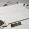 Dolce ivory 12x12 limestone white rectangular stone tiles with subtle speckled texture and smooth beveled edges