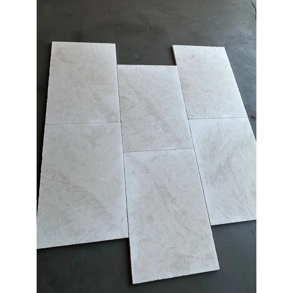 Dolce Ivory 12x24 limestone white marble-effect tiles with gray veining