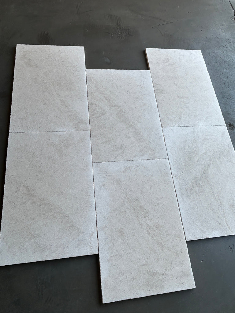 Dolce Ivory 12x24 limestone white marble-effect tiles with gray veining
