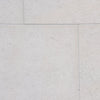 Dolce Ivory 18x36 limestone brushed tiles in light gray textured stone with speckles