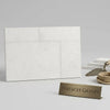 White marble-effect dolce ivory 18x36 limestone brushed tiles arranged in a modern minimalist layout