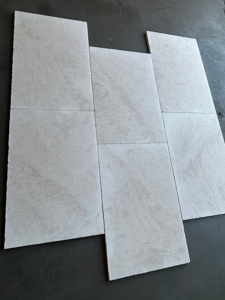 Dolce Ivory 18X36 limestone tile in light gray marbled matte finish