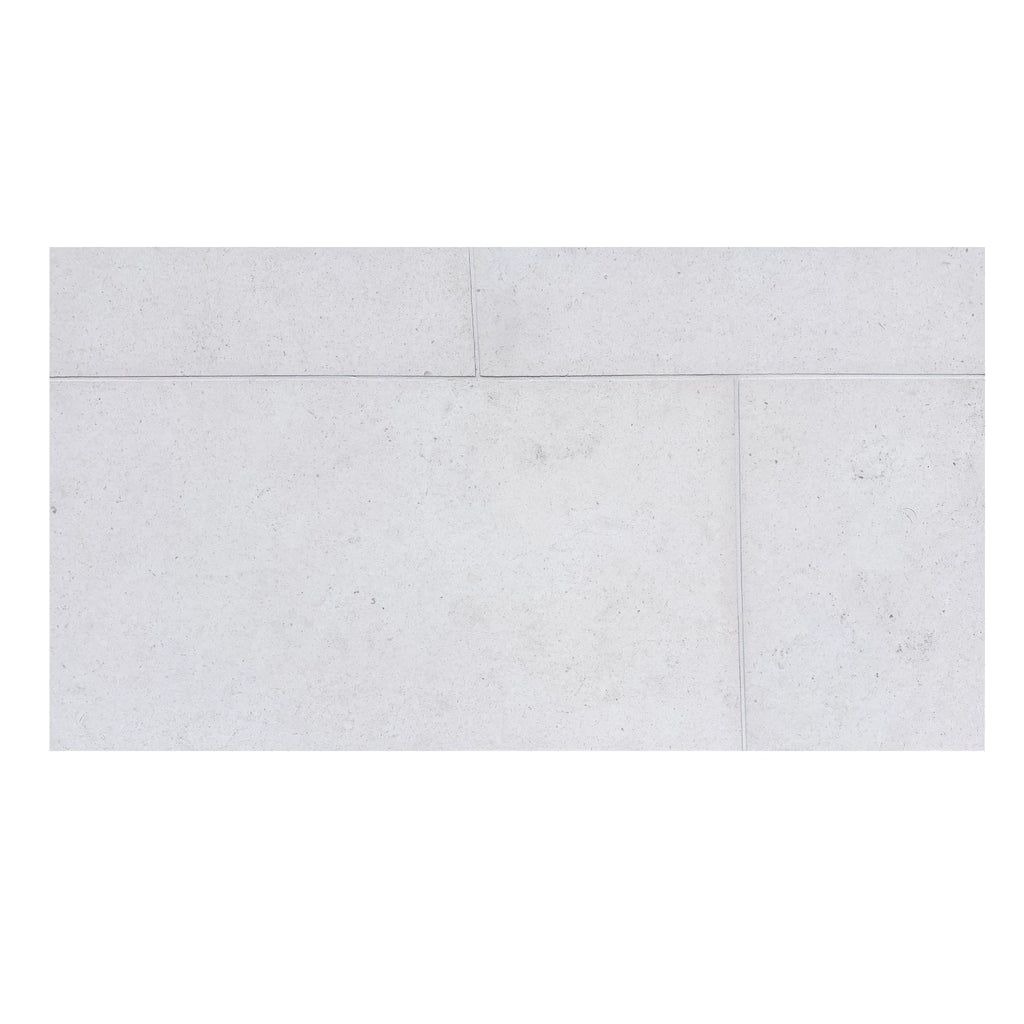 Dolce Ivory 24x24 limestone tiles in white with subtle speckled texture and veining