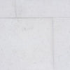 Dolce Ivory 24x24 limestone tiles with white textured stone, gray speckles, precise grout