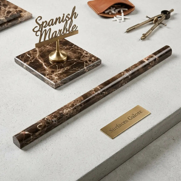 Brown Spanish marble pen holder with swirling golden veining and polished cylindrical design from Emperador Dark collection
