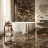 White marble freestanding bathtub with a draped beige towel showcasing Emperador Dark Marble 24x24 polished tile