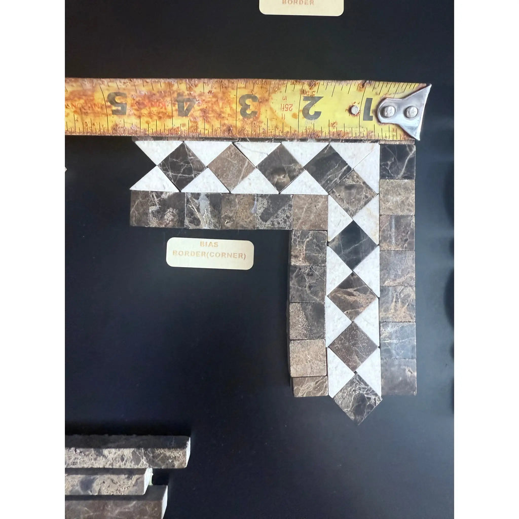 Emperador Dark Marble 2x12 Bias Border mosaic tile corner with tape measure for scale