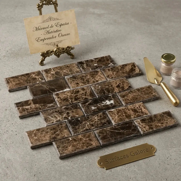 Emperador dark marble 2x4 brick mosaic tumbled brown and gold veined marble tiles arranged in a herringbone pattern