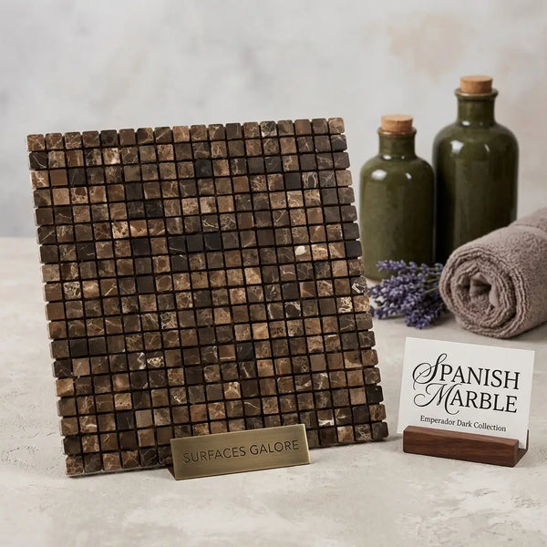 A square emperador dark marble 5/8x5/8 mosaic tumbled tile panel with dark brown and gold veining on a brass stand