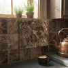 Brown emperador dark marble cutting board with swirling veining and slightly raised edge in 6x6 tumbled finish