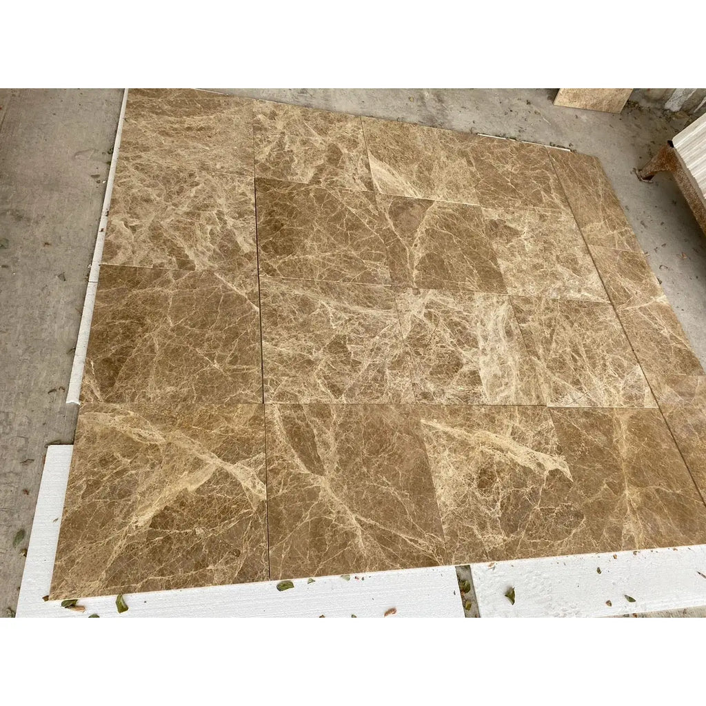 Brown marble tile arrangement of Emperador Light Marble 4x4 Tumbled product