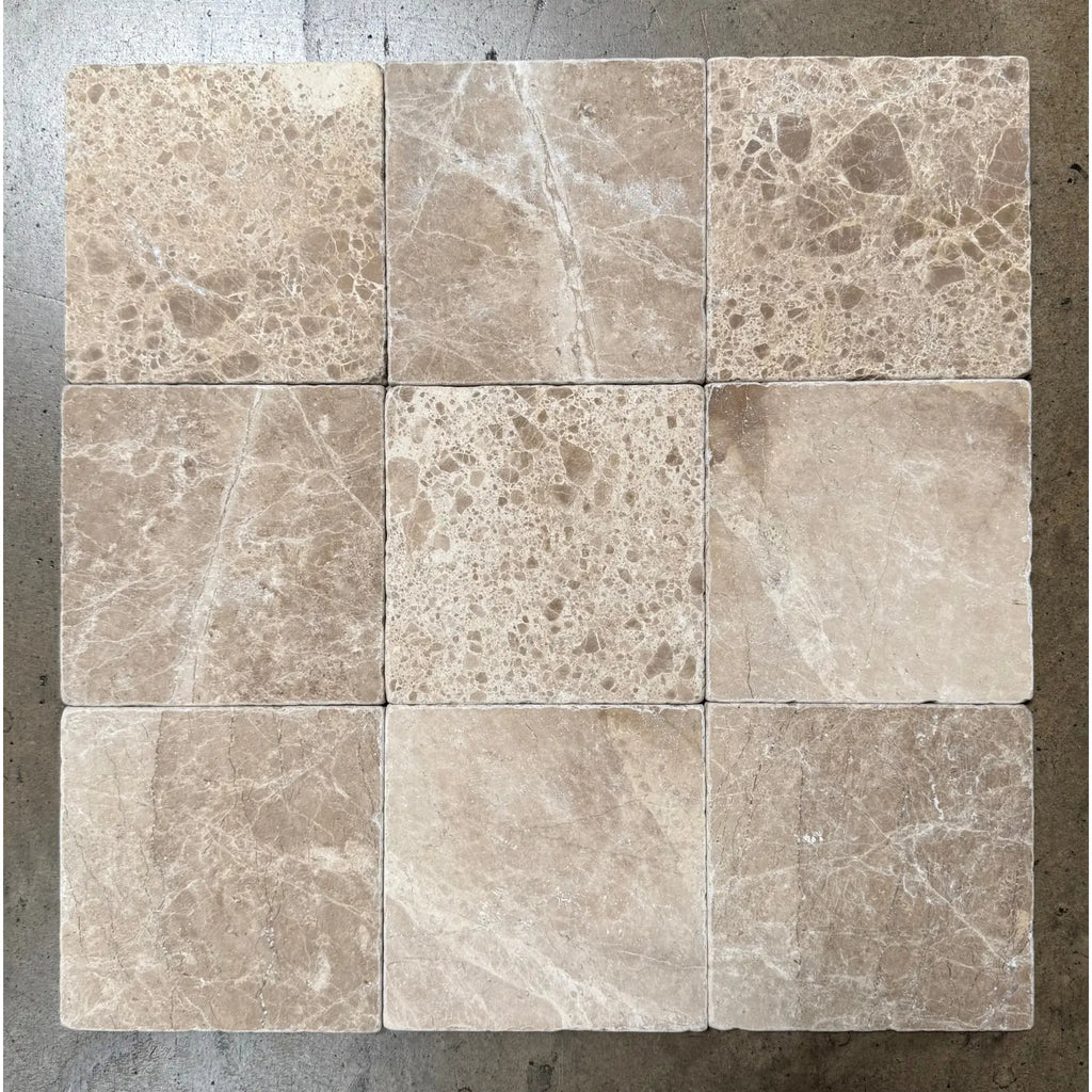 Nine square Emperador Light Marble tiles in 6x6 tumbled finish for elegant flooring