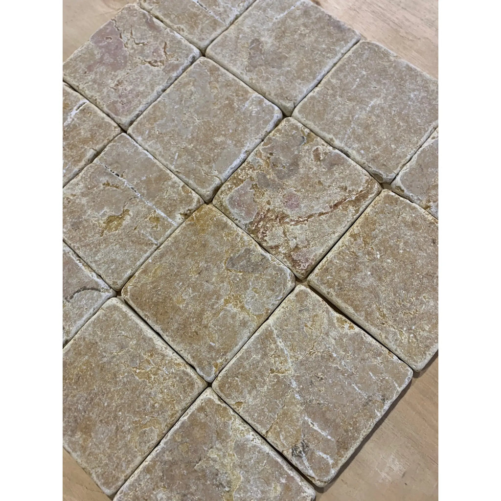 Giallo Reale Gold-Yellow Marble 4x4 Tumbled Tile with gray and beige stone texture