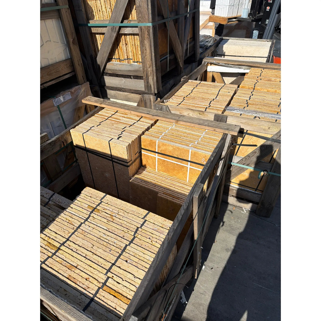 Gold yellow travertine Versailles pattern tumbled tile set in crates