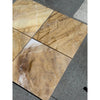 Four polished Golden Horizon Marble 12x12 tiles with natural brown and white veining