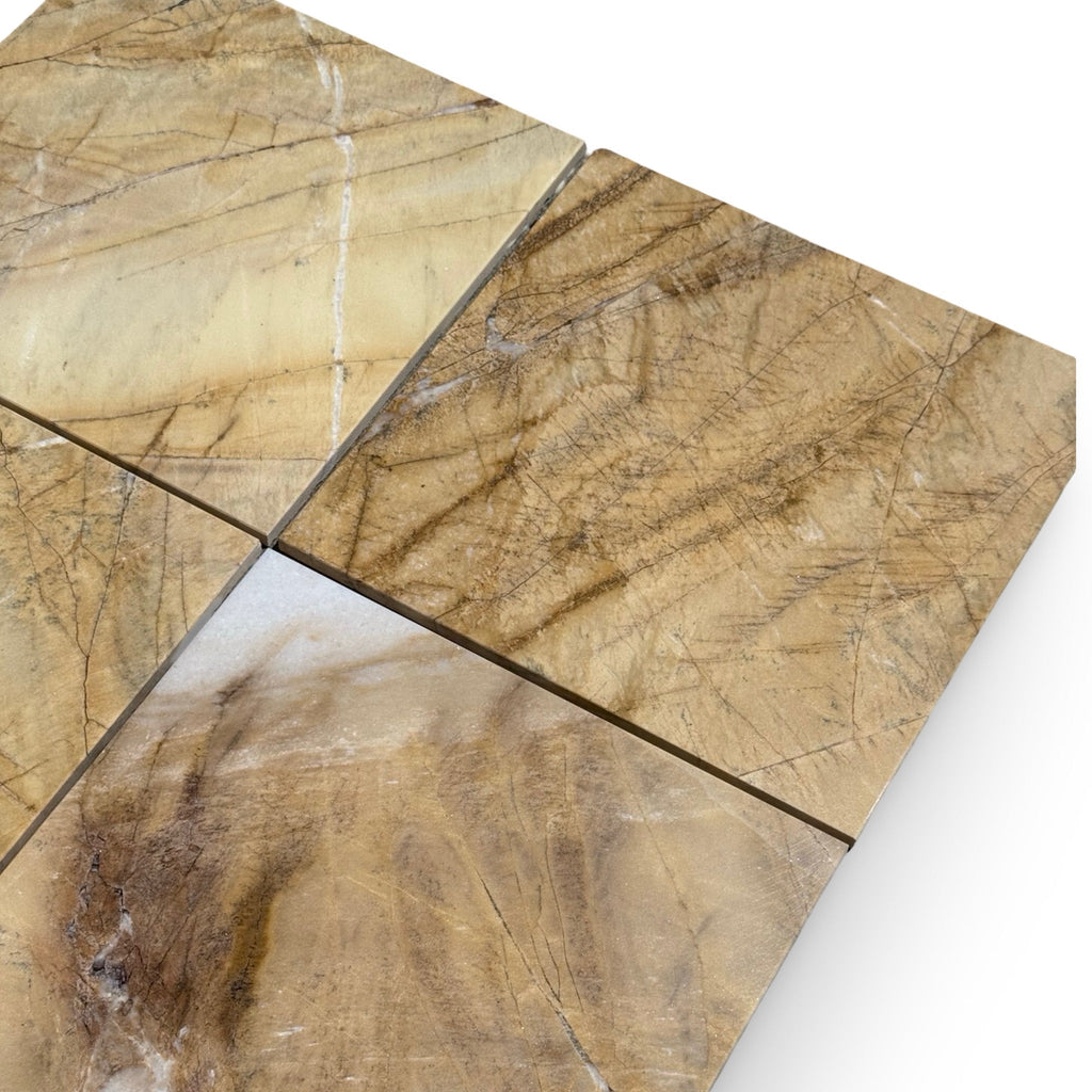 Four light brown and tan natural stone tiles with dark veining from Golden Horizon Marble 12X12 Polished