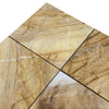 Four polished Golden Horizon Marble tiles with light brown, gold, white, and dark brown veining