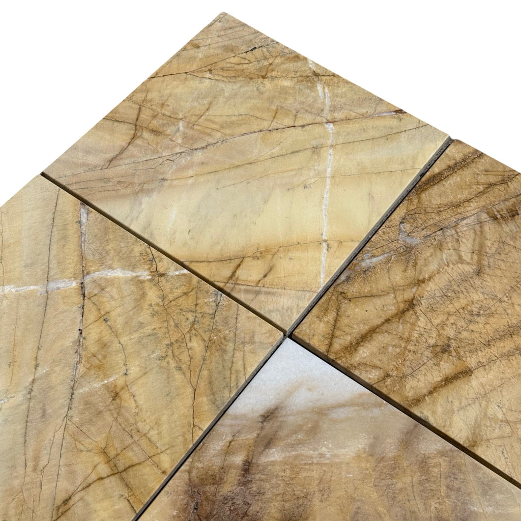 Four polished Golden Horizon Marble tiles with light brown, gold, white, and dark brown veining