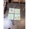 Four square translucent green onyx tiles, 12x12 polished with swirling veins