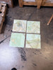 Four square translucent green onyx tiles, 12x12 polished with swirling veins