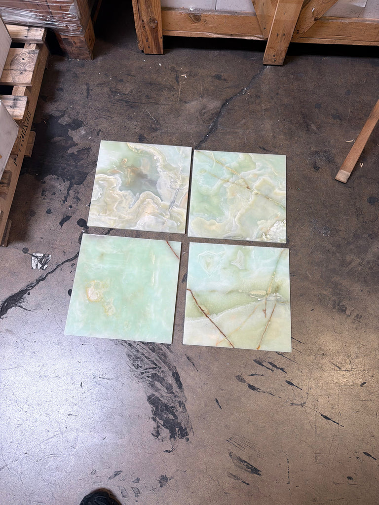 Four square translucent green onyx tiles, 12x12 polished with swirling veins