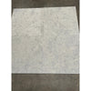 Four Greyhaven 12x12 honed limestone tiles in gray marble grid