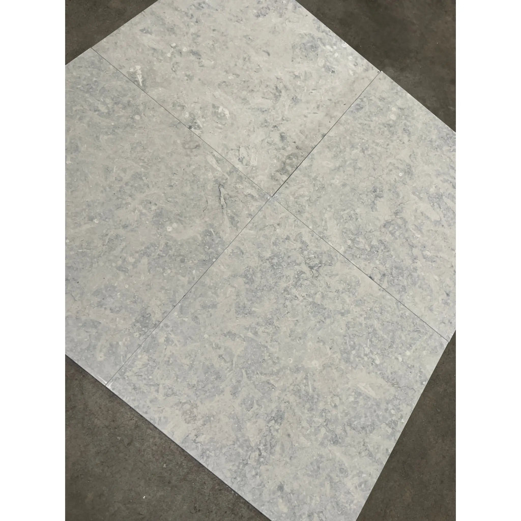 Greyhaven 12x12 limestone honed gray marble-effect tiles with subtle veining and polished finish