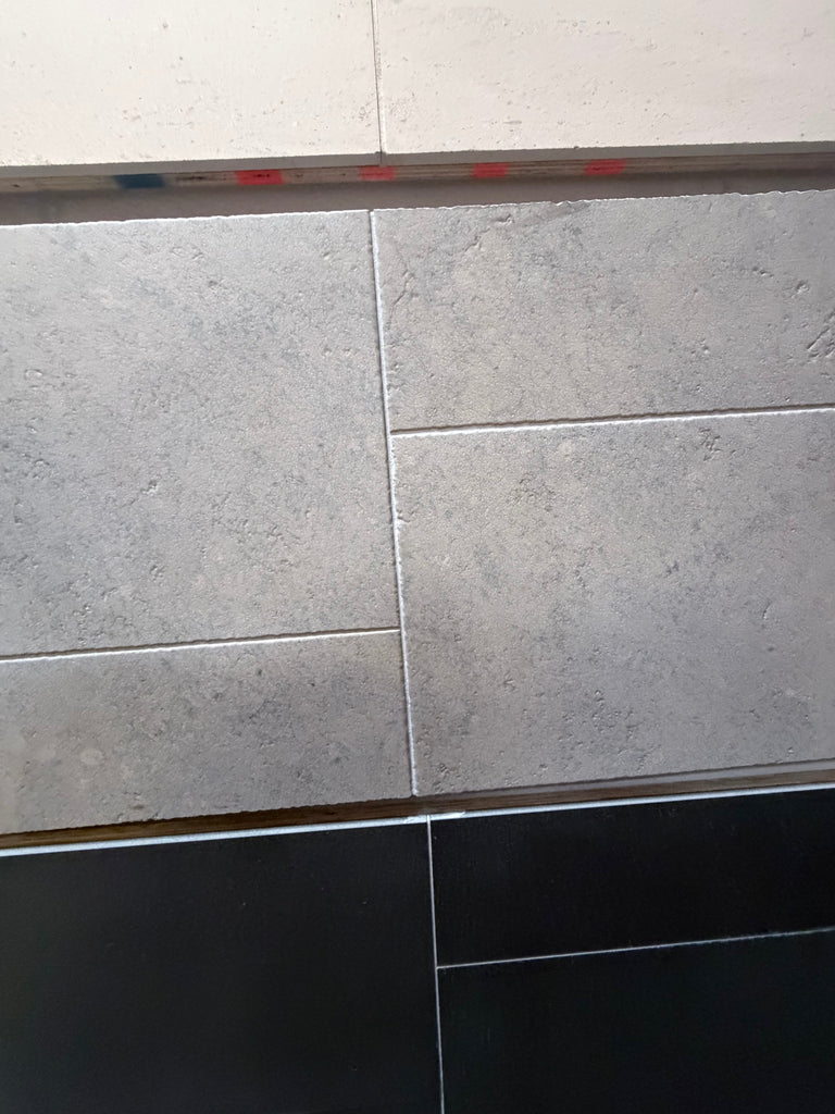 Greyhaven 12x12 honed limestone tiles with gray stone-effect staggered pattern