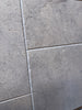 Greyhaven 12x12 limestone honed tiles with gray stone-effect, textured matte finish and subtle veining