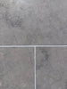 Greyhaven 12x12 honed limestone tile with gray stone, subtle veining, matte finish, thin white grout