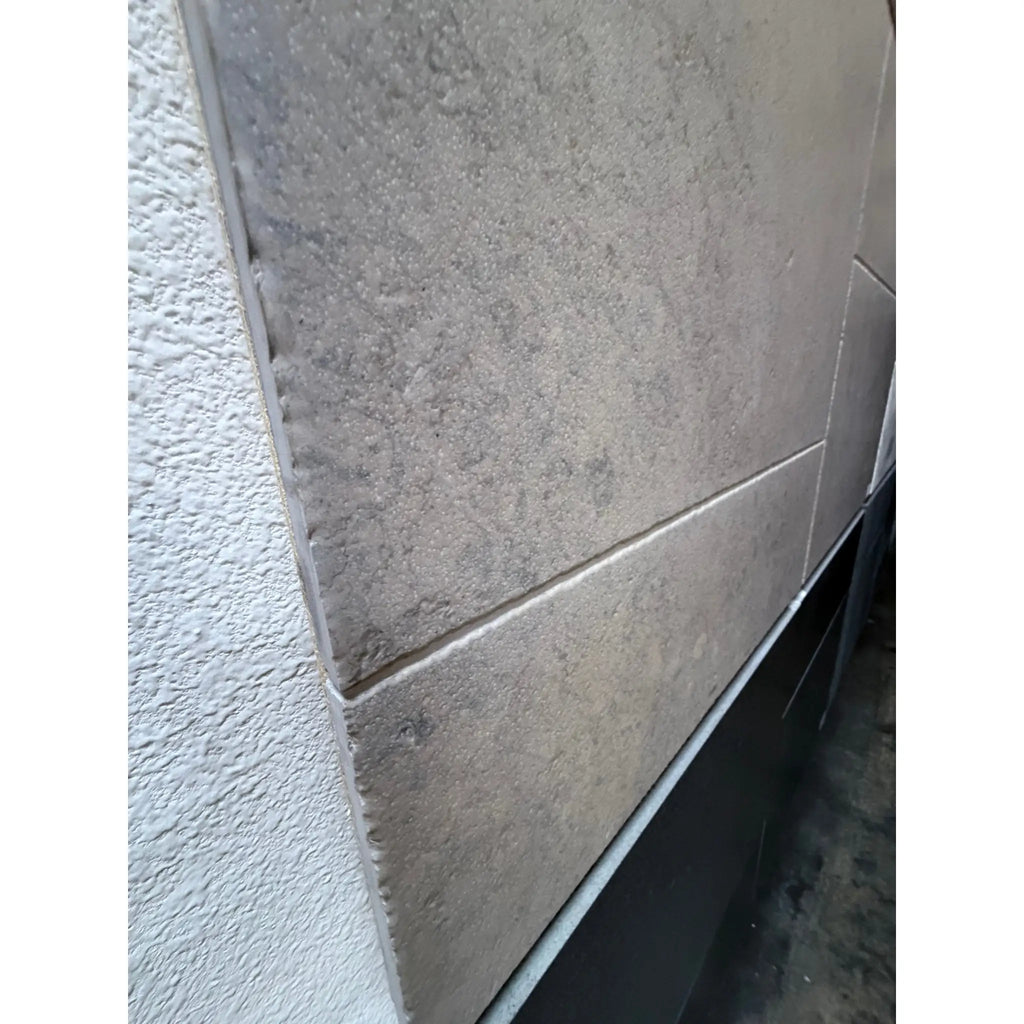 Greyhaven 12x12 limestone honed tile with gray textured stone, subtle veining, matte finish