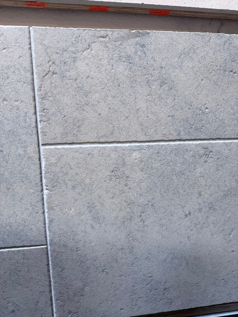 Greyhaven 12x24 limestone honed gray stone-effect wall tiles with textured matte finish