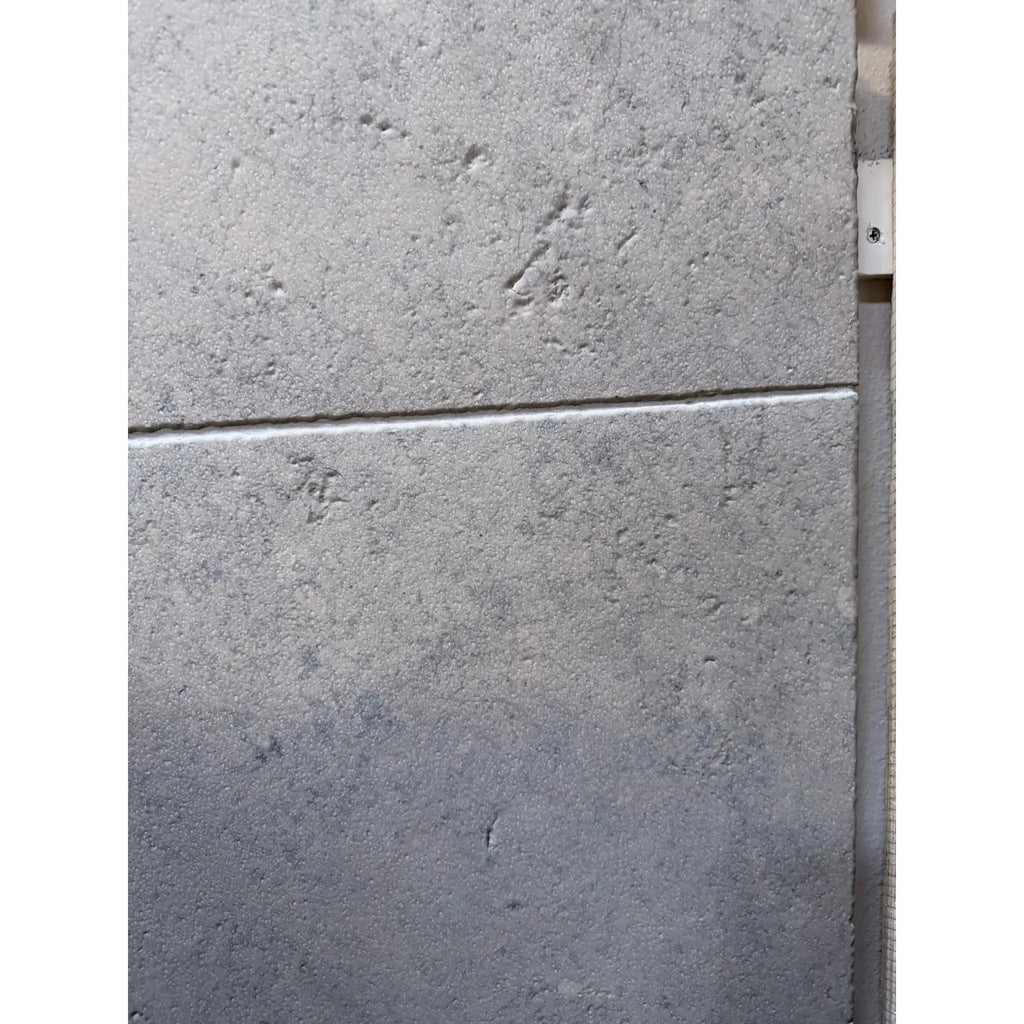 Greyhaven 12x24 honed limestone tile with gray textured matte finish