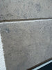 Greyhaven 12x24 honed limestone tile with gray textured surface and subtle speckles