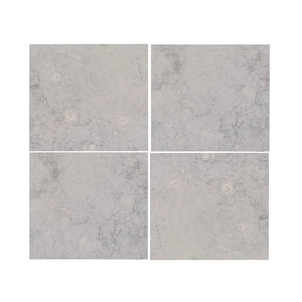 Four square Greyhaven 18x18 limestone honed tiles with subtle gray veining