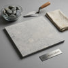 Greyhaven 18x18 limestone honed tile in light gray with subtle white and darker gray veining for elegant flooring