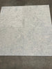 Four Greyhaven 24x24 honed limestone tiles in gray marble-effect grid
