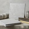 Greyhaven 24x24 limestone honed tile featuring gray marble effect with subtle veining and a smooth polished surface