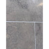 Greyhaven 24x24 honed limestone tiles with gray stone, subtle veining, white grout