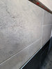Greyhaven 24x24 limestone honed tiles with gray textured veining and matte finish