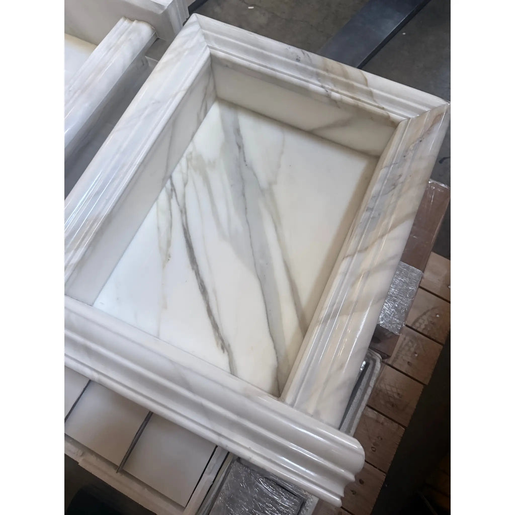 Marble-framed recessed shelf in a Hand Made Marble Shampoo Niche for elegant bathroom storage