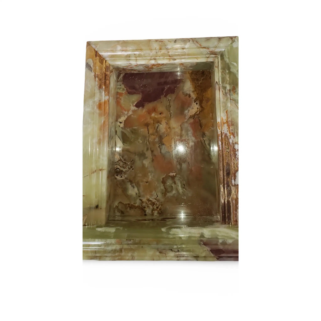 Ornate marble niche featured in Hand Made Marble Shampoo Niche for elegant bath decor