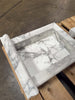 Rectangular white marble shower pan with grey veining and fluted edge for Handmade Marble Shampoo Niche
