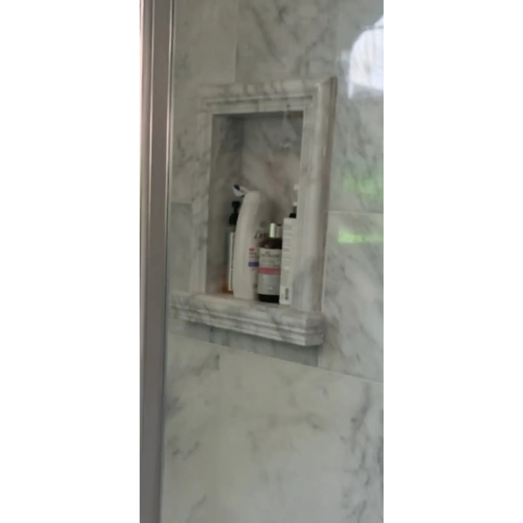 Hand Made Marble Shampoo Niche featuring a marble shower niche with toiletries displayed