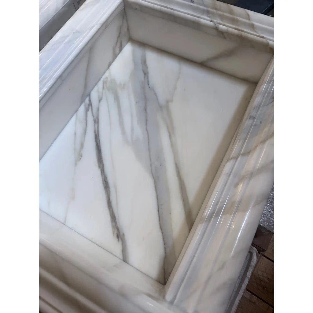 Handmade marble shampoo niche showcasing a stylish marble sink basin design
