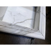 Handmade marble shampoo niche with white front, gray veining, reeded edge