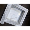 Handmade white marble shampoo niche with veined surface and recessed molding