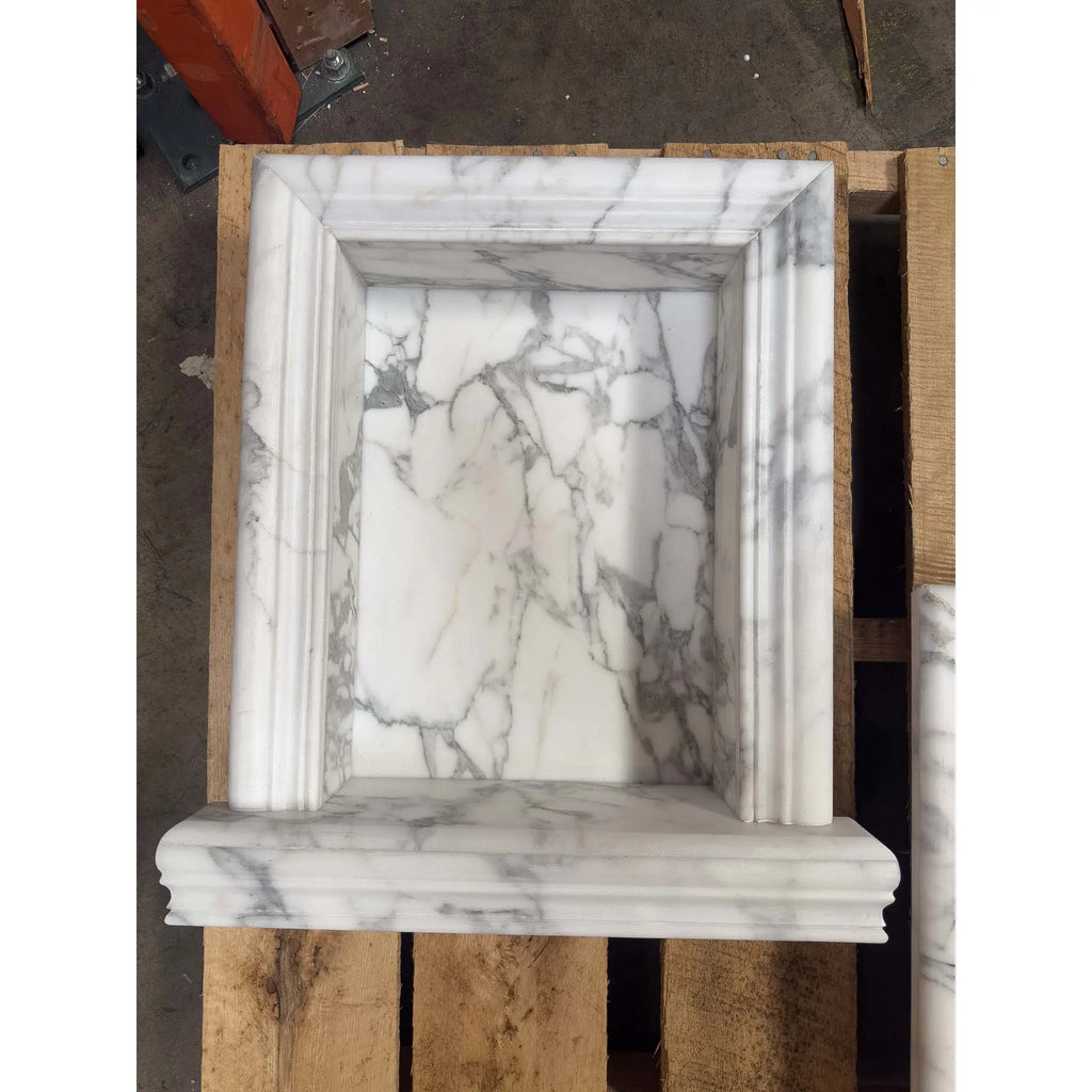 White marble fireplace surround with rectangular inset and fluted design for Hand Made Marble Shampoo Niche